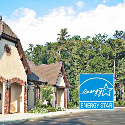 Exterior photo of buildings in Tower Village office park with an Energy Star logo overlaid in the corner